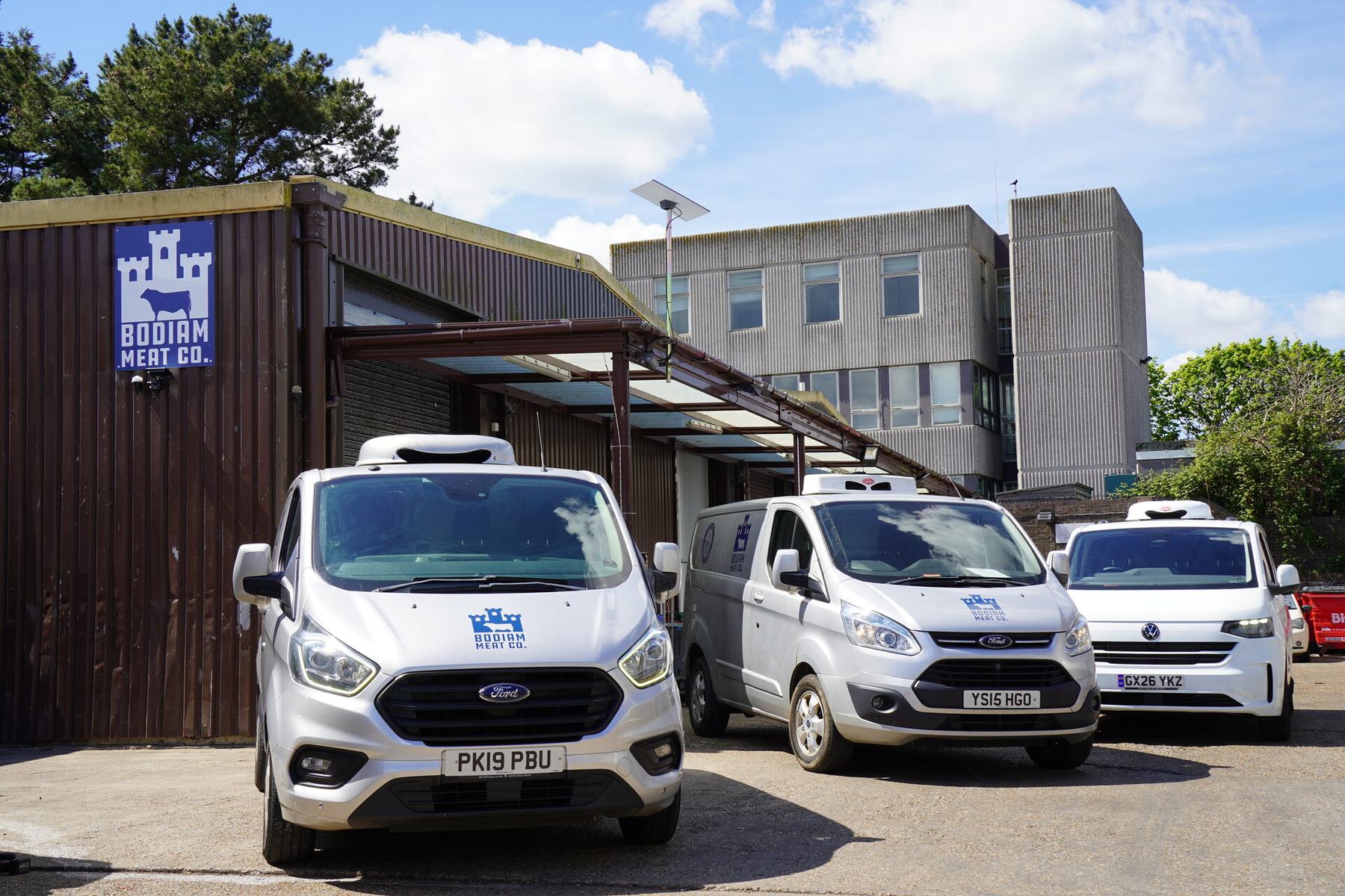 Three Bodiam Meat Co. vans outside the depot
