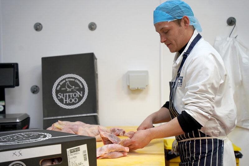 Levi breaking down whole cuts in the Bodiam Foods cutting room
