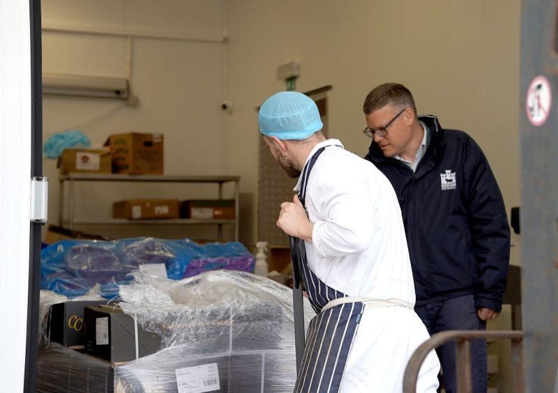 Bodiam Foods team reviewing the morning's food service pallet at the depot